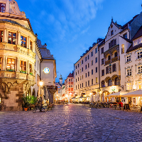 Town square with cobbled street in Munich Germany 1x1 CROP
